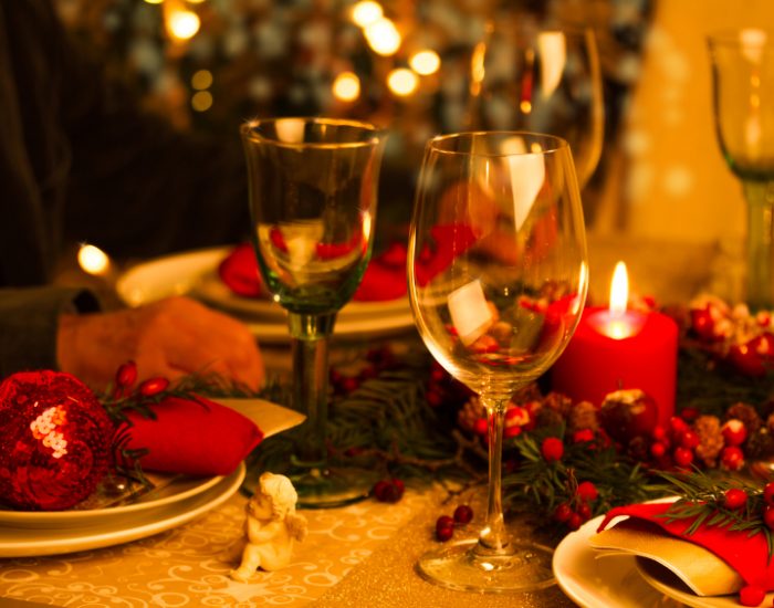 Beautifully set table in red and gold for Christmas Eve